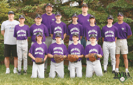 A group of young baseball players in purple shirts.
